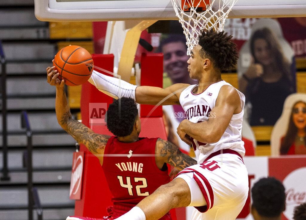 Doug Mcschooler Indiana forward Trayce Jackson-Davis (23) blocks a shot by Rutgers guard Jacob Young (42) during the second half of an NCAA college basketball game, Sunday, Jan. 24, 2021, in Bloomington, Ind. (AP Photo/Doug McSchooler)