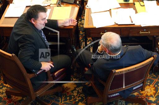 John Hanna In this photo from Wednesday, March 31, 2021, Kansas state Sen. Rob Olson, left, R-Olathe, converses with Sen. Ron Ryckman Sr., R-Meade, during a debate at the Statehouse in Topeka, Kan. Olson will be a key player in the drafting of the final version of a bill aimed at modernizing the state's unemployment system and giving legislators more oversight of technology upgrades at the Kansas Department of Labor. (AP Photo/John Hanna)