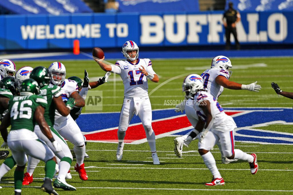 Jeffrey T. Barnes FILE - In this Sunday, Sept. 13, 2020, file photo, Buffalo Bills quarterback Josh Allen (17) throws a pass during the second half of an NFL football game against the New York Jets in Orchard Park, N.Y. If Brian Flores' rebuilding project with the Miami Dolphins is to end atop the AFC East, he must find a way to beat Josh Allen and the Bills. (AP Photo/Jeffrey T. Barnes, File)