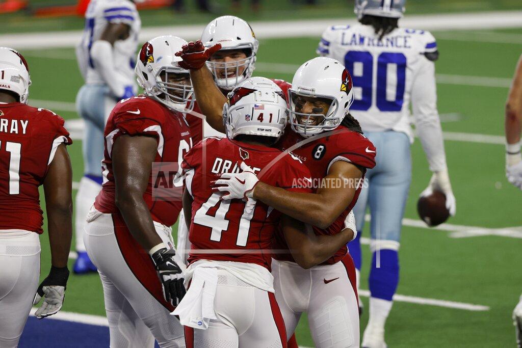 Ron Jenkins Arizona Cardinals' Kenyan Drake (41), and Larry Fitzgerald, right, celebrate a touchdown scored by Drake in the first half of an NFL football game in Arlington, Texas, Monday, Oct. 19, 2020. (AP Photo/Ron Jenkins)