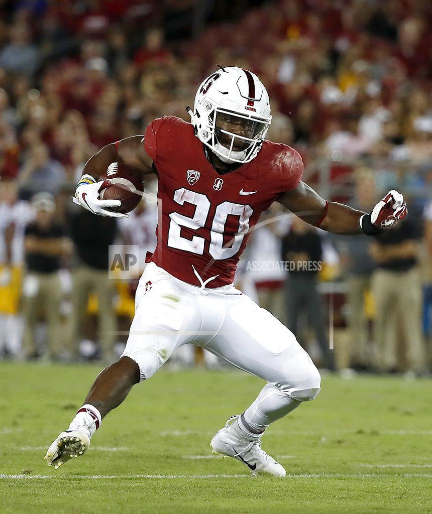 FILE - In this Saturday, Sept. 8, 2018, file photo, Stanford running back Bryce Love (20) rushes against Southern California during the second half of an NCAA college football game in Stanford, Calif. Ninth-ranked Stanford will be without running back Bryce Love when facing UC Davis on Saturday. Love apparently suffered an undisclosed injury late in the 17-3 win against USC last week. (AP Photo/Tony Avelar, File)