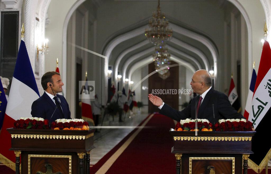 Gonzalo Fuentes Iraqi President Barham Salih, right, speaks toward French President Emmanuel Macron during their press conference at the Salam Palace Wednesday, Sept. 2, 2020 in Baghdad. French President Emmanuel Macron is the first head of state to visit the Iraqi capital since Prime Minister Mustafa al-Kadhimi, Iraq's former intelligence chief, formed a new government in May. (Gonzalo Fuentes/Pool via AP)