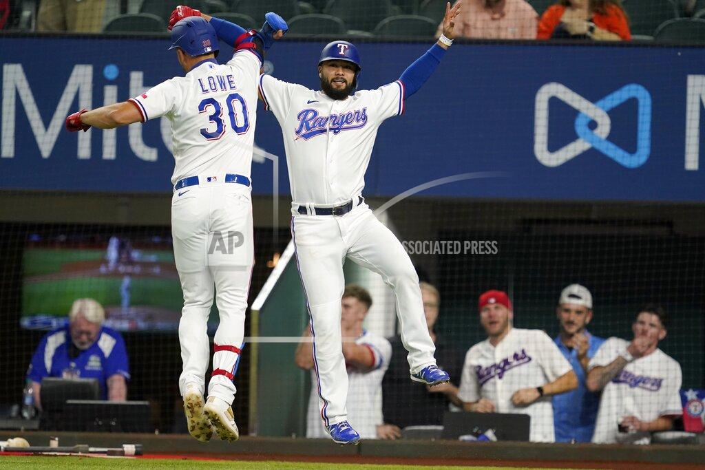 Tony Gutierrez Texas Rangers' Nathaniel Lowe (30) and Isiah Kiner-Falefa, right, celebrate after Lowe hit a two-run home run that scored Kiner-Falefa during the first inning of the team's baseball game against the Houston Astros in Arlington, Texas, Tuesday, Sept. 14, 2021. (AP Photo/Tony Gutierrez)