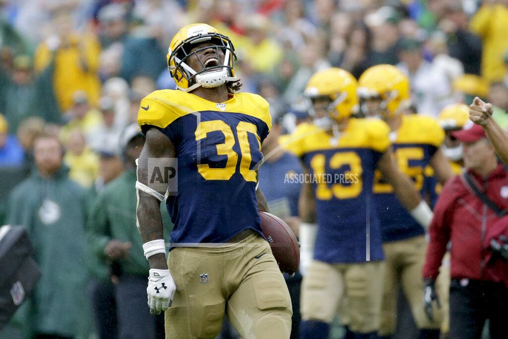 Mike Roemer Green Bay Packers running back Jamaal Williams celebrates running for a first down during the second half of an NFL football game against the Denver Broncos, Sunday, Sept. 22, 2019, in Green Bay, Wis. (AP Photo/Mike Roemer)