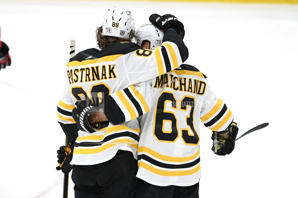 Nick Wass Boston Bruins right wing David Pastrnak (88) celebrates his goal with left wing Brad Marchand (63) during the second period of an NHL hockey game against the Washington Capitals, Monday, Feb. 1, 2021, in Washington. (AP Photo/Nick Wass)