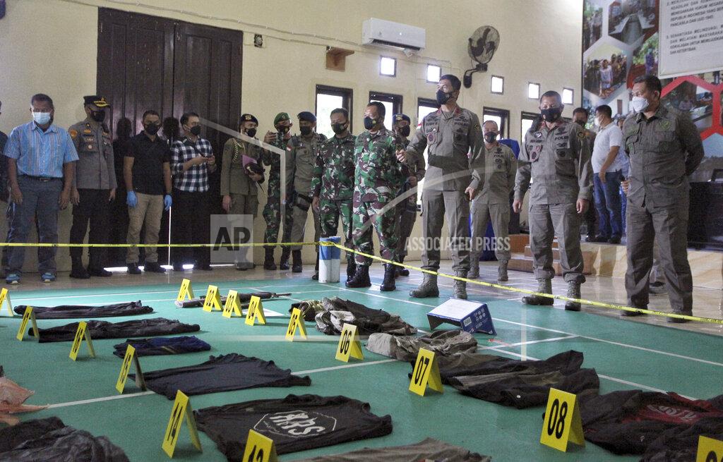 Mohammad Taufan Evidence items confiscated from Ali Kalora and Jaka Ramadan, two militants who were killed during shootout with security forces, are displayed for the media during a press conference at the Parigi Moutong Police Station in Parigi Moutong district, Central Sulawesi, Indonesia, Sunday, Sept. 19, 2021. Indonesia's most wanted militant with ties to the Islamic State group was killed Saturday in a shootout with security forces, the Indonesian military said, in a sweeping counterterrorism campaign against extremists in the remote mountain jungles. (AP Photo/Mohammad Taufan)
