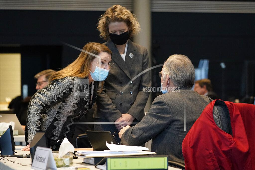 Virginia State Sen. Siobhan Dunnavant, left, Sen. Jen Kiggans, R-Virginia Beach, center, talk with Senate minority leader Thomas Norment, James City County, during the Senate session at the Science Museum in Richmond, Va., Wednesday, Feb. 17, 2021. (AP Photo/Steve Helber)