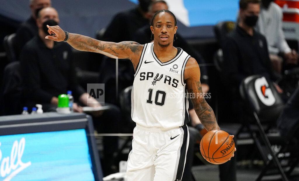 David Zalubowski San Antonio Spurs forward DeMar DeRozan directs his teammates in the first half of an NBA basketball game against the Denver Nuggets, Friday, April 9, 2021, in Denver. (AP Photo/David Zalubowski)