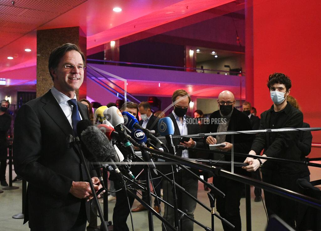 Piroschka Van De Wouw Dutch caretaker Prime Minister Mark Rutte speaks with the media following exit polls in the general election in The Hague, Netherlands, March 17, 2021. Dutch voters pushed Rutte towards a fourth term in office in a general election Wednesday, bolstering his conservative party's position as the biggest in parliament and boosting a key ally into second place, an exit poll suggested. (Piroschka van de Wouw/Pool via AP)