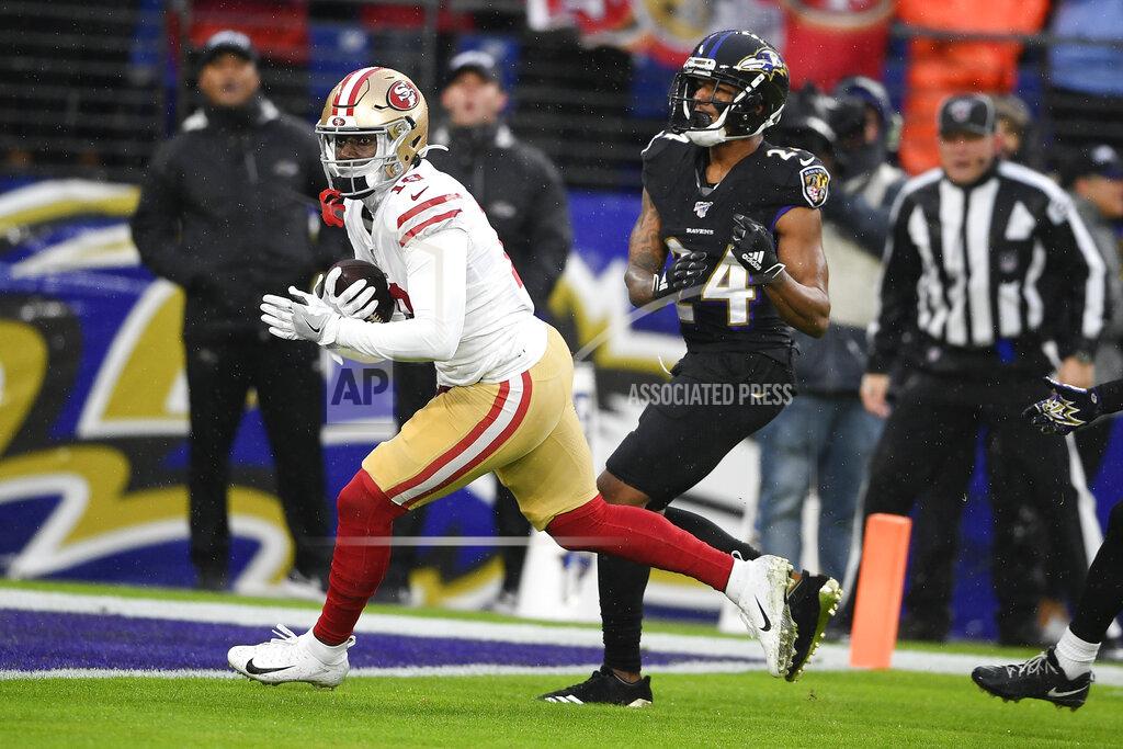 Nick Wass San Francisco 49ers wide receiver Deebo Samuel (19) rans past Baltimore Ravens cornerback Marcus Peters (24) to score a touchdown in the first half of an NFL football game, Sunday, Dec. 1, 2019, in Baltimore, Md. (AP Photo/Nick Wass)