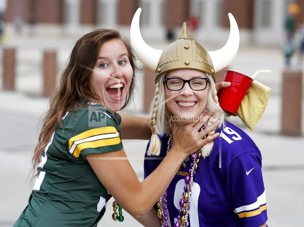 Matt Ludtke Green Bay Packers fan Courtney Ashwell and Minnesota Vikings Chelsea Ashwell have some fun outside Lambeau Field before an NFL football game Sunday, Sept. 15, 2019, in Green Bay, Wis. (AP Photo/Matt Ludtke)