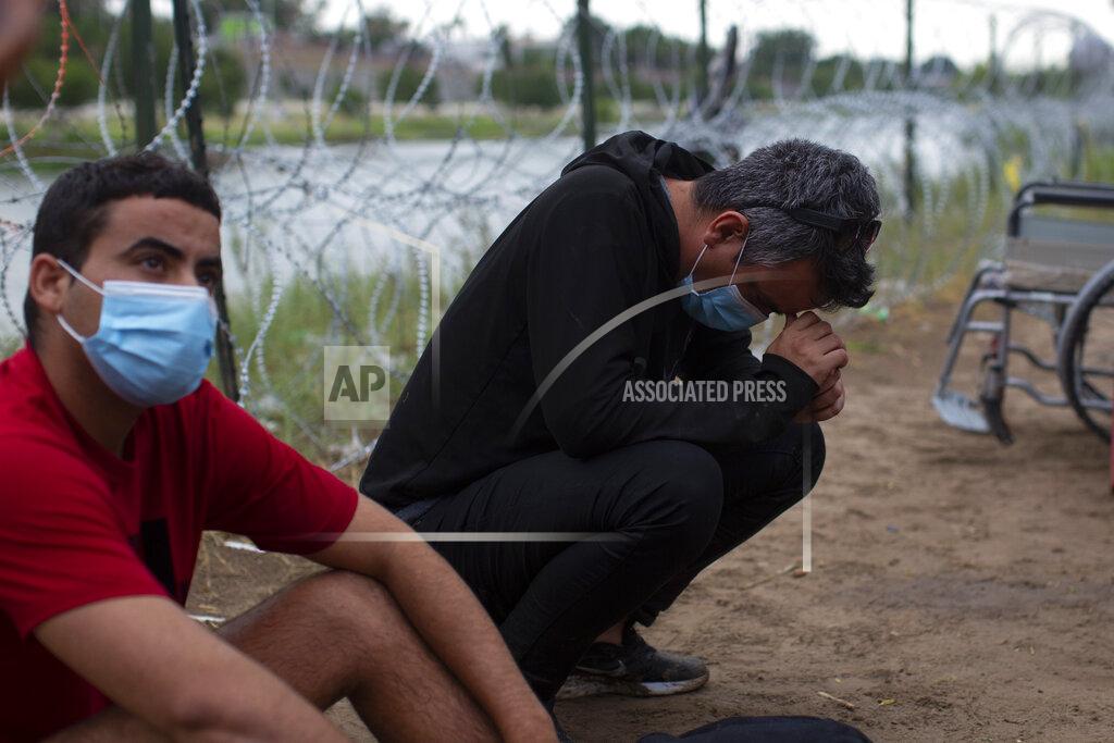 Dario Lopez-Mills Migrants from Cuba rest after crossing the Rio Grande river in Eagle Pass, Texas, Sunday May 22, 2022. Little has changed in what has quickly become one of the busiest corridors for illegal border crossings since a federal judge blocked pandemic-related limits on seeking asylum from ending Monday. (AP Photo/Dario Lopez-Mills)
