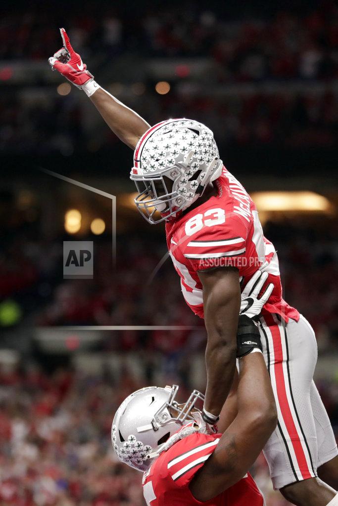 Michael Conroy Ohio State wide receiver Terry McLaurin (83) is congratulated by teammate Thayer Munford after catching a touchdown pass during the first half of the Big Ten championship NCAA college football game against Northwestern, Saturday, Dec. 1, 2018, in Indianapolis. (AP Photo/Michael Conroy)