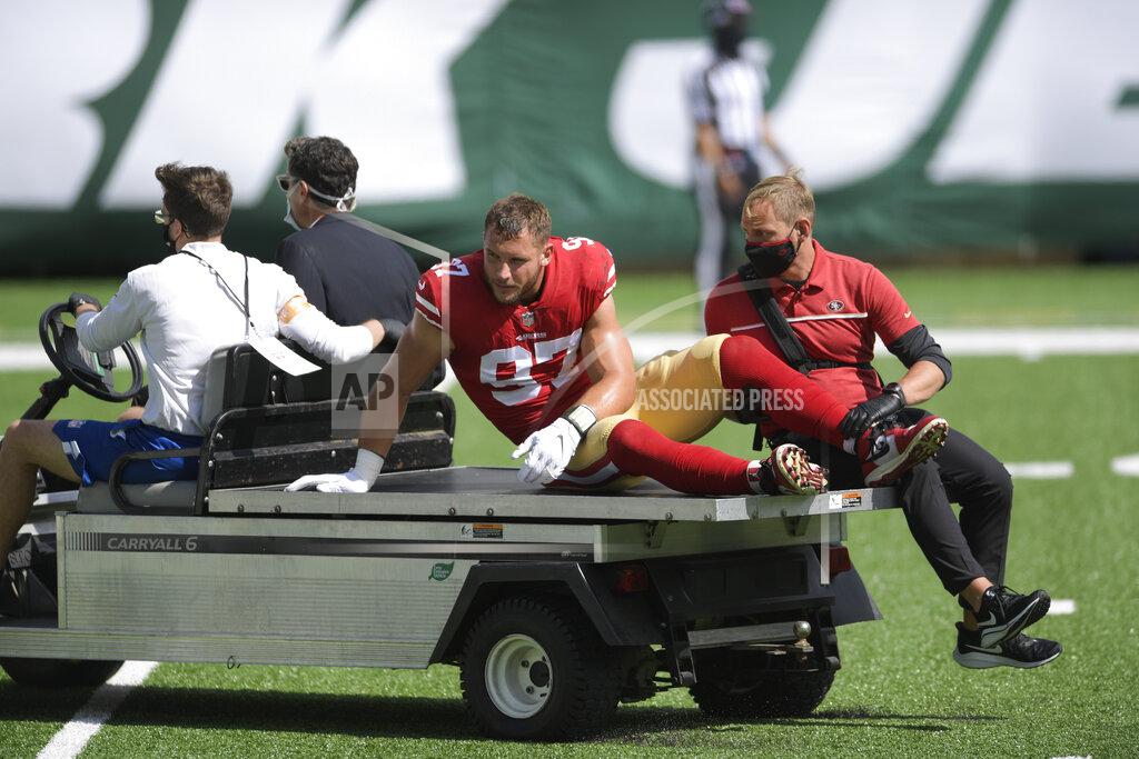 Bill Kostroun San Francisco 49ers defensive end Nick Bosa (97) is carted off the field after being injured during the first half of an NFL football game against the New York Jets, Sunday, Sept. 20, 2020, in East Rutherford, N.J. (AP Photo/Bill Kostroun)