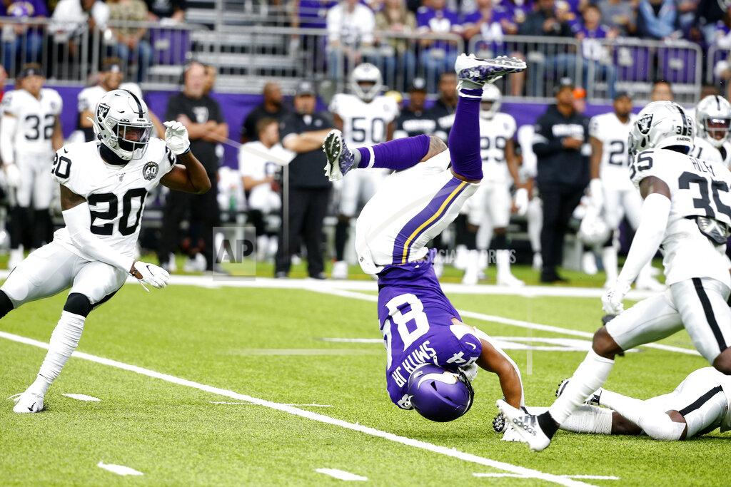 Bruce Kluckhohn Minnesota Vikings tight end Irv Smith (84) is upended between Oakland Raiders defenders Daryl Worley, left, and Curtis Riley (35) after making a reception during the first half of an NFL football game, Sunday, Sept. 22, 2019, in Minneapolis. (AP Photo/Bruce Kluckhohn)