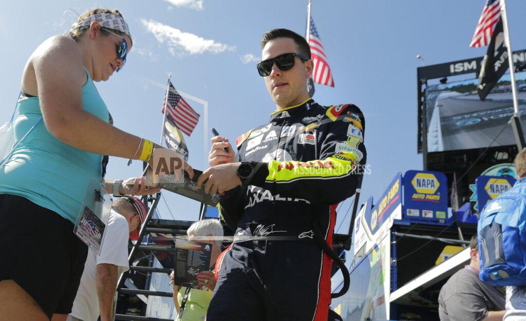 Charles Krupa Alex Bowman signs autographs prior to a NASCAR Cup Series auto race practice at New Hampshire Motor Speedway in Loudon, N.H., Saturday, July 20, 2019. Bowman wrecked his back-up car during the final practice and will drive a spare car from teammate Jimmie Johnson. (AP Photo/Charles Krupa)