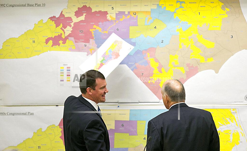 FILE - In this Feb. 16, 2016 file photo, Republican state Sens. Dan Soucek, left, and Brent Jackson, right, review historical maps during The Senate Redistricting Committee for the 2016 Extra Session in the Legislative Office Building at the N.C. General Assembly in Raleigh, N.C. North Carolina judges ordered a new U.S. House district map that Republican state legislators drew last month be used in the 2020 elections, deciding on Monday, Dec. 2, 2019, there wasn't the time to scrutinize the boundaries for extreme partisan bias. (Corey Lowenstein/The News & Observer, File via AP, File)