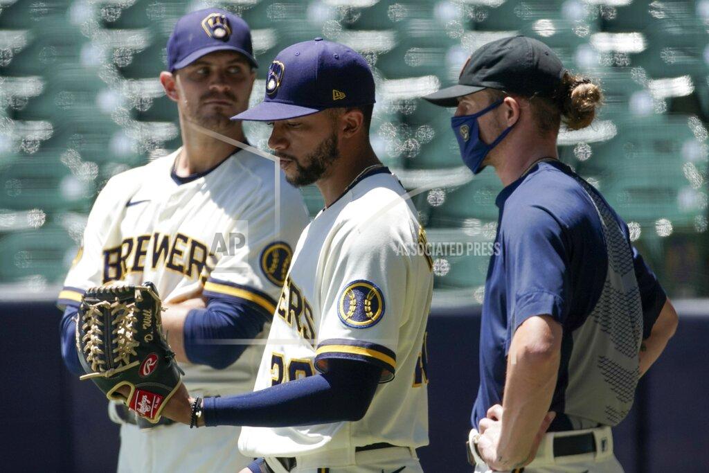 Morry Gash Milwaukee Brewers' Justin Grimm, Devin Williams and Josh Hader watch during a practice session Monday, July 13, 2020, at Miller Park in Milwaukee. (AP Photo/Morry Gash)