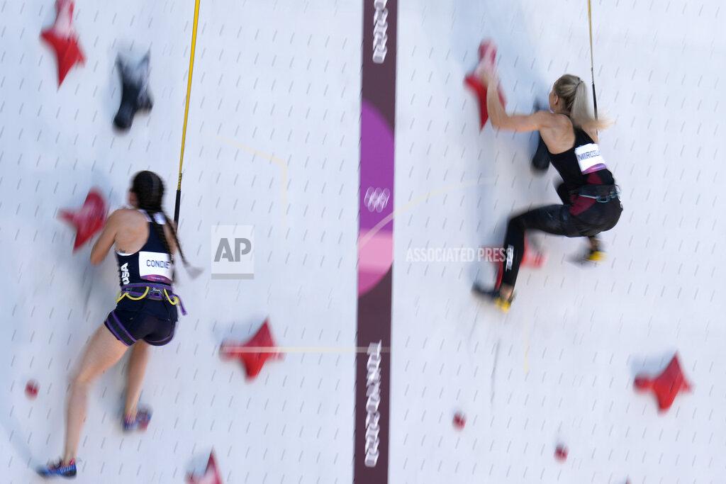 Jeff Roberson Kyra Condie, left, of the United States, races against Aleksandra Miroslaw, of Poland, during the speed qualification portion of the women's sport climbing competition at the 2020 Summer Olympics, Wednesday, Aug. 4, 2021, in Tokyo, Japan. (AP Photo/Jeff Roberson)