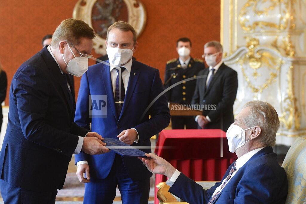 Roman Vondrous Czech president Milos Zeman, right, appoints Petr Arenberger, left, director of the Prague-Vinohrady Teaching Hospital, as the new Czech health minister, replacing the sacked Jan Blatny, in Prague, Czech Republic, Wednesday, April 7, 2021. (Roman Vondrous/CTK via AP)