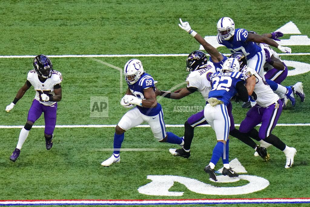 Aj Mast Indianapolis Colts inside linebacker Bobby Okereke (58) runs after recovering a fumble against the Baltimore Ravens in the second half of an NFL football game in Indianapolis, Sunday, Nov. 8, 2020. (AP Photo/AJ Mast)