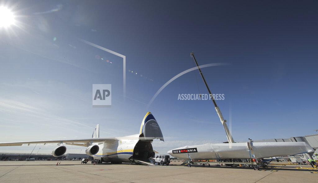 Mark Lloyd This Sept. 28, 2020, photo provided by INEOS Team UK shows the INEOS TEAM UK America's Cup race boat being towed onto an Antonov cargo plane at the start of its journey to Auckland, New Zealand at London Stansted Airport in England. England's never-ending quest to win back the America's Cup it lost so long ago is taking another step forward with the team's relocation to New Zealand for sailing's marquee regatta. (Mark Lloyd Images/INEOS Team UK via AP)