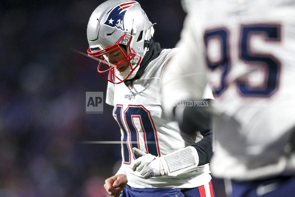 Joshua Bessex New England Patriots quarterback Mac Jones (10) runs off the field at halftime of an NFL wild-card playoff football game against the Buffalo Bills, Saturday, Jan. 15, 2022, in Orchard Park, N.Y. (AP Photo/Joshua Bessex)