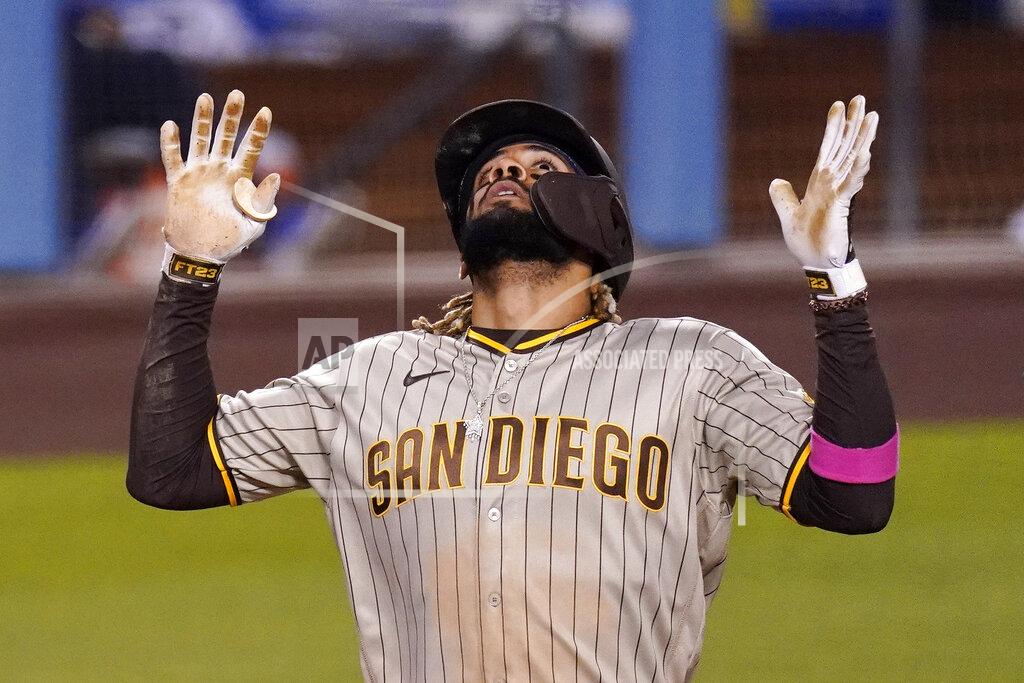 Mark J. Terrill San Diego Padres' Fernando Tatis Jr. celebrates his solo home run as he scores during the fifth inning of a baseball game against the Los Angeles Dodgers Friday, April 23, 2021, in Los Angeles. (AP Photo/Mark J. Terrill)