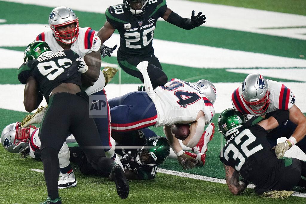 Corey Sipkin New England Patriots' Rex Burkhead (34), center, dives into the end zone during the second half of an NFL football game against the New York Jets, Monday, Nov. 9, 2020, in East Rutherford, N.J. (AP Photo/Corey Sipkin)