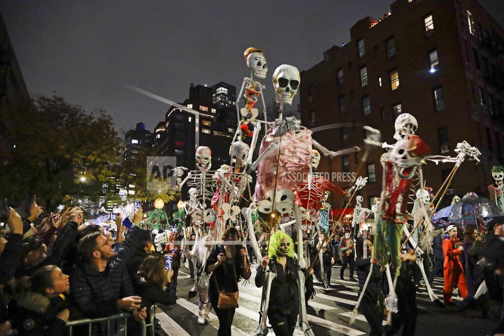 Frank Franklin Ii FILE - In this Oct. 31, 2019 file photo, revelers march in the Greenwich Village Halloween Parade in New York. This year's parade was canceled by the coronavirus pandemic, but fun and spooky activities planned around the city included a puppet parade, an Empire State Building memory game and socially distant trick-or-treating. (AP Photo/Frank Franklin II, File)