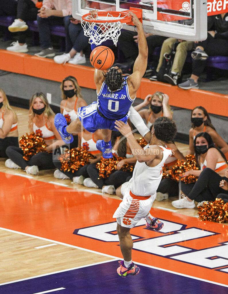 Ken Ruinard Clemson guard David Collins (13) fouls Duke forward Wendell Moore Jr (0) during the first half of an NCAA college basketball game in Clemson, S.C., Thursday, Feb. 10, 2022. Collins was ejected. Duke beat Clemson 82-64. (Ken Ruinard/The Independent-Mail via AP)