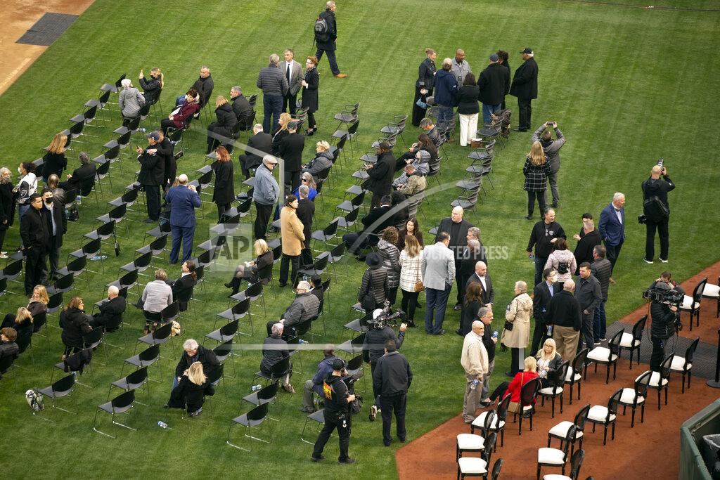 D. Ross Cameron Guests gather on the field of the Oakland-Alameda County Coliseum before a memorial service for former NFL coach and television commentator John Madden, Monday, Feb. 14, 2022, in Oakland, Calif. Madden died last year at age 85. (AP Photo/D. Ross Cameron)