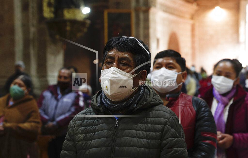 Juan Karita Catholic faithful wearing masks to curb the spread of the new coronavirus attend a Mass at the San Francisco Basilica in La Paz Bolivia, Sunday, Sept. 27, 2020. Churches have reopened for Mass after being closed for months because of the pandemic lockdown. (AP Photo/Juan Karita)