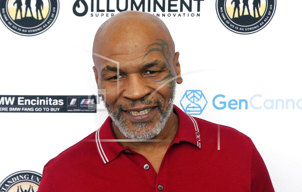 Willy Sanjuan FILE - Mike Tyson attends a celebrity golf tournament in Dana Point, Calif., Aug. 2, 2019. Authorities will not file criminal charges against former heavyweight champ Mike Tyson after he was recorded on video punching a fellow first-class passenger aboard a plane at San Francisco International Airport last month, prosecutors announced Tuesday, May 10, 2022. (Photo by Willy Sanjuan/Invision/AP, File)