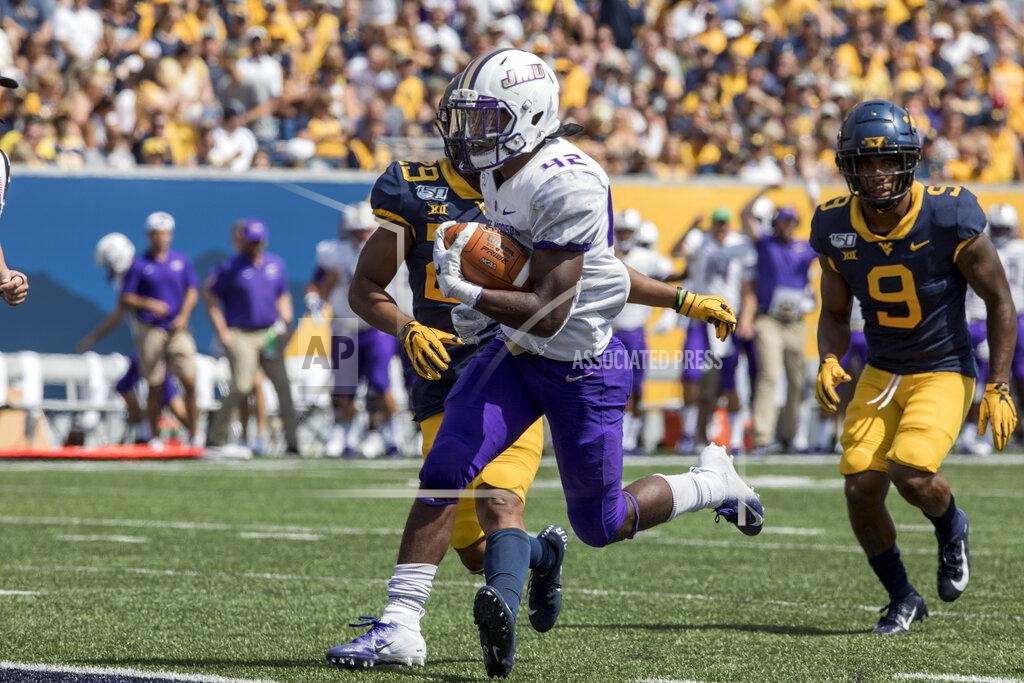 Ray Thompson James Madison running back Solomon Vanhorse (42) runs for a touchdown during the first half of an NCAA college football game Saturday, Aug. 31, 2019, in Morgantown, W.Va. (AP Photo/Raymond Thompson)