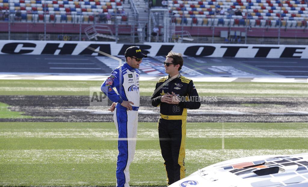 Chuck Burton David Ragan, left, talks with Landon Cassill before qualifying for Saturday's NASCAR All-Star Cup series auto race at Charlotte Motor Speedway in Concord, N.C., Friday, May 17, 2019. (AP Photo/Chuck Burton)