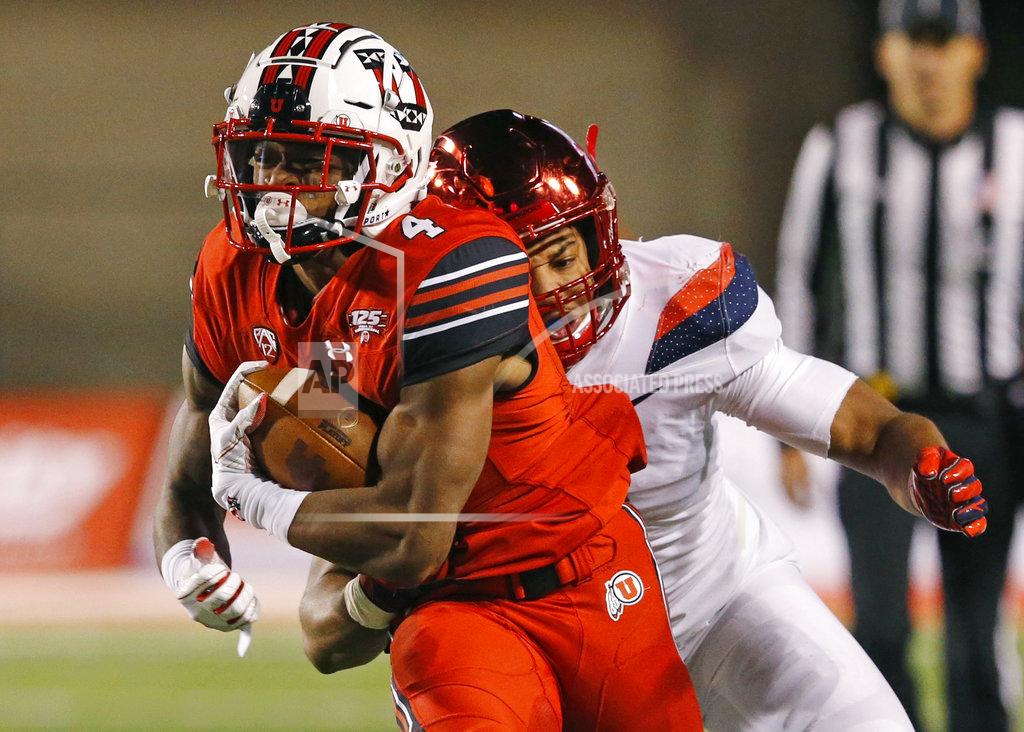 Rick Bowmer Arizona linebacker Tony Fields II, rear, tackles Utah running back TJ Green (4) during the first half of an NCAA college football game Friday, Oct. 12, 2018, in Salt Lake City. (AP Photo/Rick Bowmer)