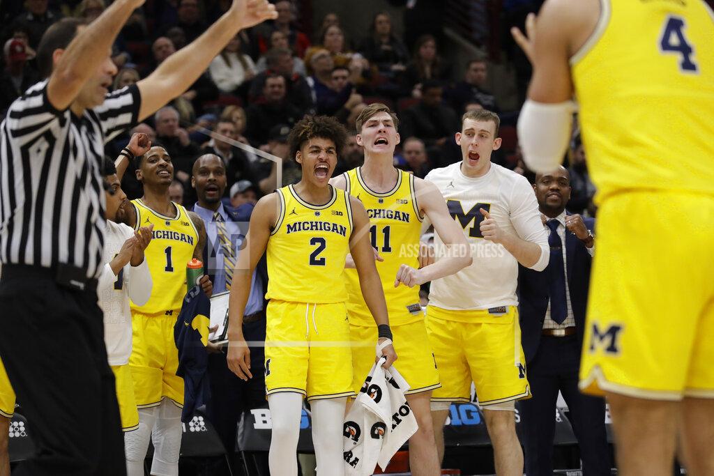 Nam Y. Huh Michigan bench react to a play during the first half of an NCAA college basketball game against Iowa in the quarterfinals of the Big Ten Conference tournament, Friday, March 15, 2019, in Chicago. (AP Photo/Nam Y. Huh)