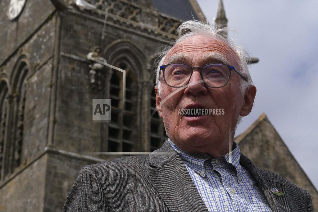 Nicolas Garriga Henri-Jean Renaud, 86, poses outside the church in Sainte-Mere-Eglise, Normandy, Friday, June 4, 2021. Henri-Jean Renaud, 86, remembers D-Day like it was yesterday. He was a young boy and was hidden in his family home in Sainte-Mere-Eglise when more than 800 planes bringing U.S. paratroopers flew over the town while German soldiers machine guns were firing at them. (AP Photo/Nicolas Garriga)