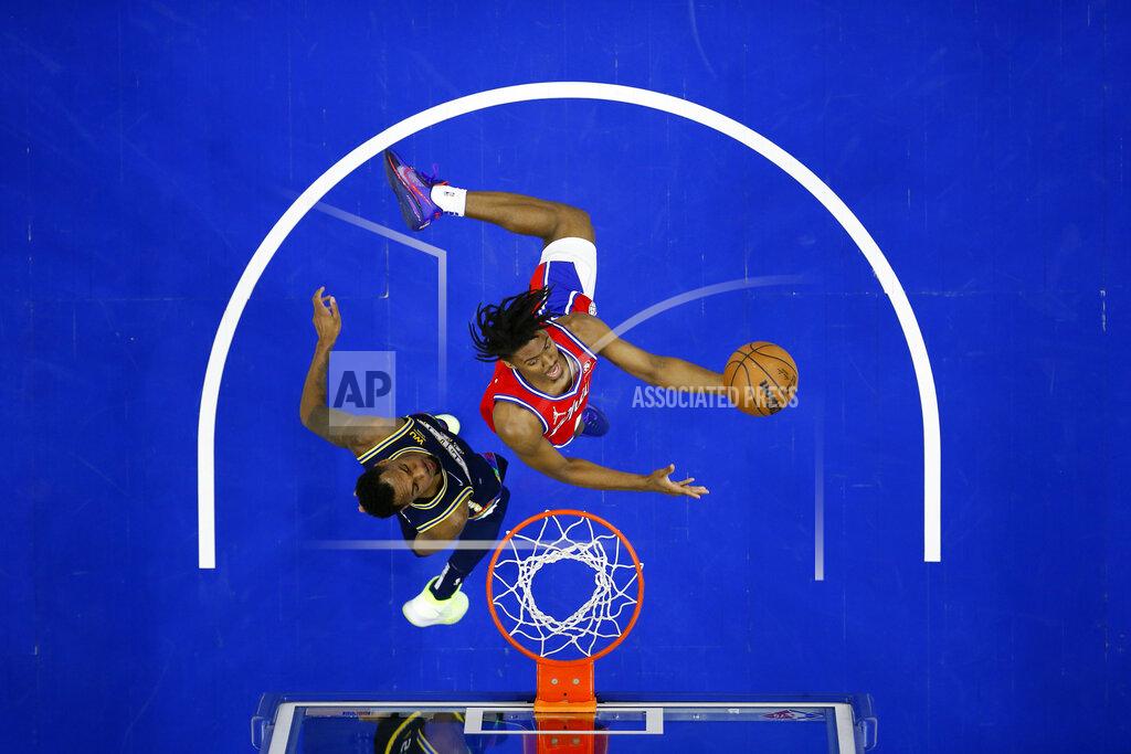 Matt Slocum Philadelphia 76ers' Tyrese Maxey, right, goes up for a shot against Denver Nuggets' Monte Morris during the first half of an NBA basketball game, Monday, March 14, 2022, in Philadelphia. (AP Photo/Matt Slocum)
