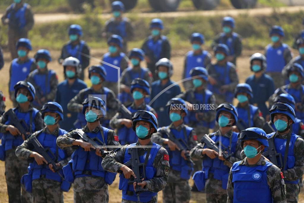 Ng Han Guan Chinese United Nations troop take part in the Shared Destiny 2021 drill at the Queshan Peacekeeping Operation training base in Queshan County in central China's Henan province Wednesday, Sept. 15, 2021. Peacekeeping troops from China, Thailand, Mongolia and Pakistan took part in the 10 days long exercise that field reconnaissance, armed escort, response to terrorist attacks, medical evacuation and epidemic control. (AP Photo/Ng Han Guan)