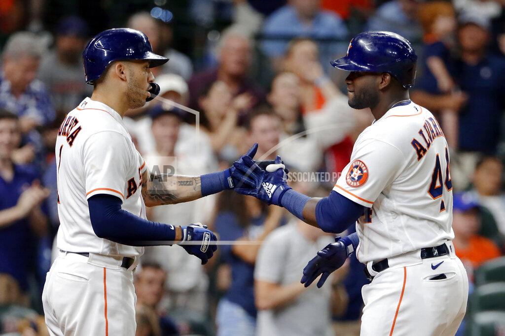 Michael Wyke Houston Astros Carlos Correa, left, and Yordan Alvarez (44) celebrate Alvarez's home run during the seventh inning of the team's baseball game against the Texas Rangers on Saturday, July 24, 2021, in Houston. (AP Photo/Michael Wyke)
