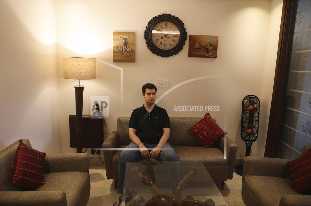 Manish Swarup Karan Murgai, an IT management consultant for a multinational based in Dallas, sits in his Delhi house, in New Delhi, India, Tuesday, June 30, 2020. Murgai came to Delhi in March this year after his father died. Murgai and at least 1,000 others like him, whose U.S. visas are tied to their jobs in the U.S., are now stranded in India, after an executive order signed by President Donald Trump that suspends applications for H-1B and other high-skilled work visas from abroad. (AP Photo/Manish Swarup)