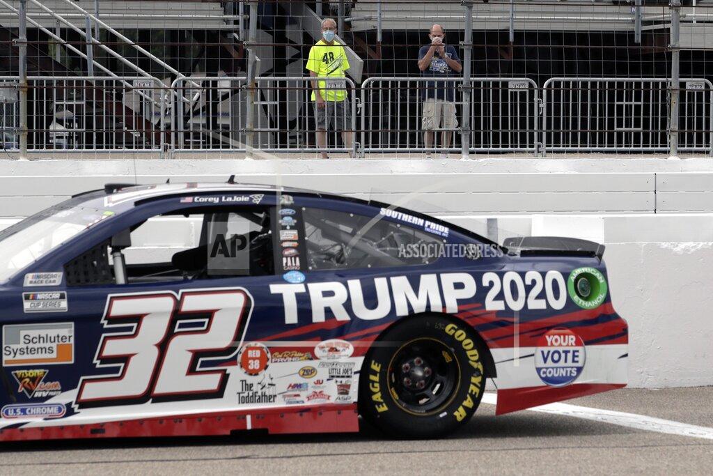 Charles Krupa Fans view the car of NASCAR driver Corey LaJoie (32), bearing wording to support the re-election bid of President Donald Trump, before a NASCAR Cup Series auto race, Sunday, Aug. 2, 2020, at the New Hampshire Motor Speedway in Loudon, N.H. (AP Photo/Charles Krupa)