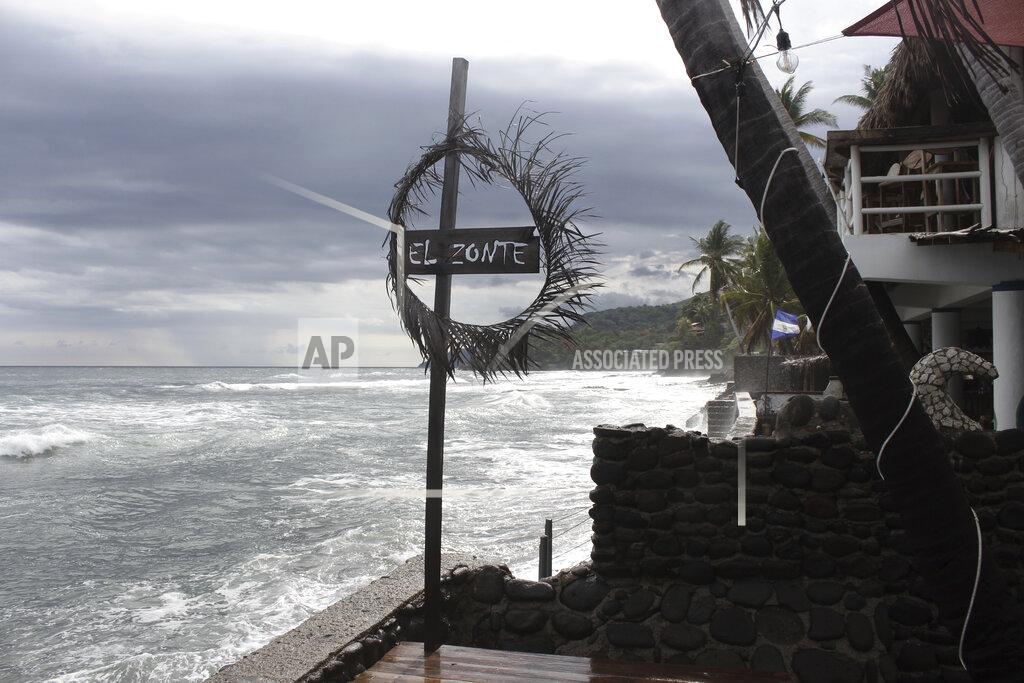 Salvador Melendez Restaurants overlook El Zonte beach in Tamanique, El Salvador, Wednesday, June 9, 2021. In this beach community, a nongovernmental organization with the financial backing of an anonymous Bitcoin donor has been trying to create a small-scale cryptocurrency economy, and could serve as a showcase for the gains and struggles to introduce a phone-based cryptocurrency as the country embarks on a nationwide experiment after making Bitcoin legal tender this week. (AP Photo/Salvador Melendez)