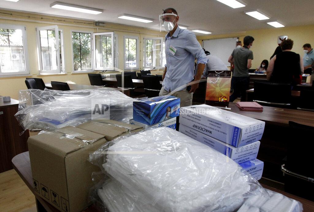 Boris Grdanoski Protective medical equipment for special election teams visiting voters who have coronavirus, are stored at the municipal election commission headquarters in Skopje, North Macedonia, Monday, July 13, 2020. North Macedonia holds its first parliamentary election under its new country name this week, with voters heading to the polls during an alarming spike of coronavirus cases in the small Balkan nation. Opinion polls in the run-up to Wednesday’s vote indicate a close race between coalitions led by the Social Democrats and the center-right opposition VMRO-DPMNE party. (AP Photo/Boris Grdanoski)