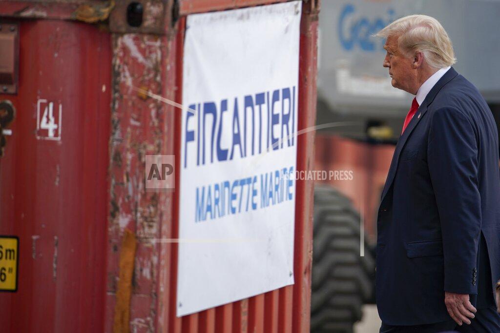 Morry Gash President Donald Trump leaves the stage after speaking at an event at Fincantieri Marinette Marine, Thursday, June 25, 2020, in Marinette, Wis. (AP Photo/Morry Gash)