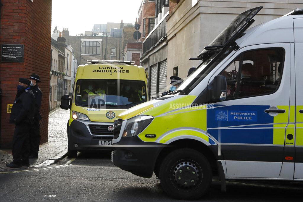 Frank Augstein Police officers stand at an entrance to the King Edward VII Hospital where Prince Philip is being treated for an infection, as an ambulance is driven out, in London, Monday, March 1, 2021. (AP Photo/Frank Augstein)