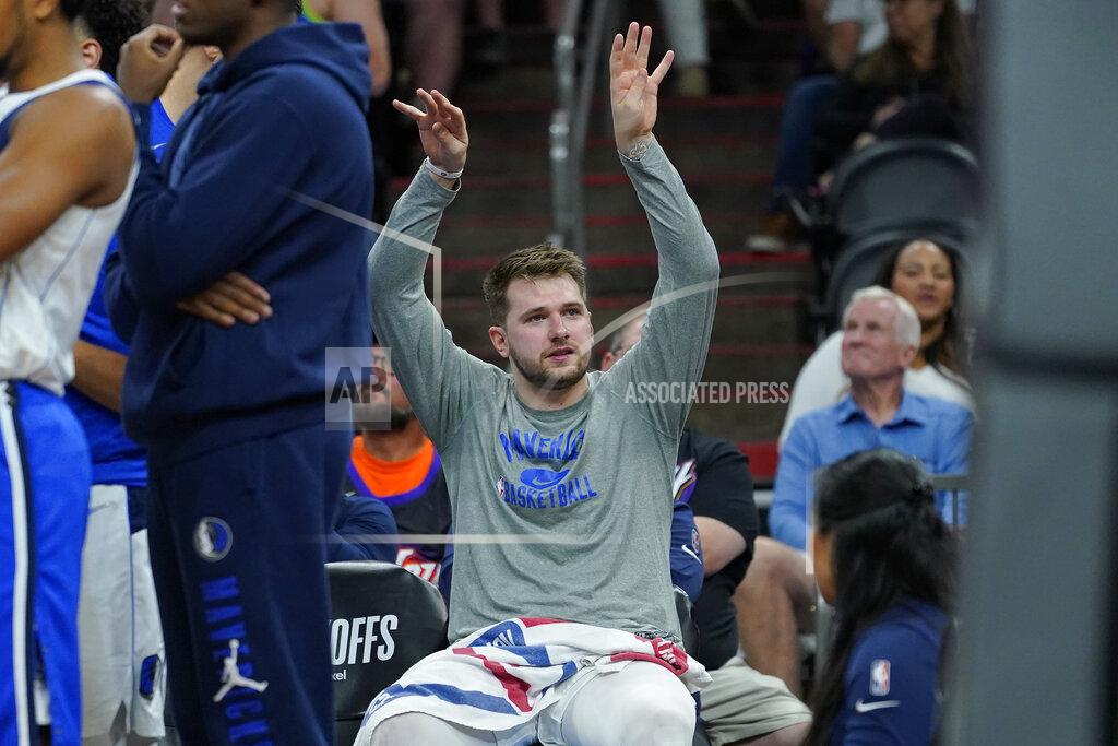 Matt York Dallas Mavericks guard Luka Doncic celebrates on the bench during the second half of Game 7 of an NBA basketball Western Conference playoff semifinal against the Phoenix Suns, Sunday, May 15, 2022, in Phoenix. The Mavericks defeated the Suns 123-90. (AP Photo/Matt York)