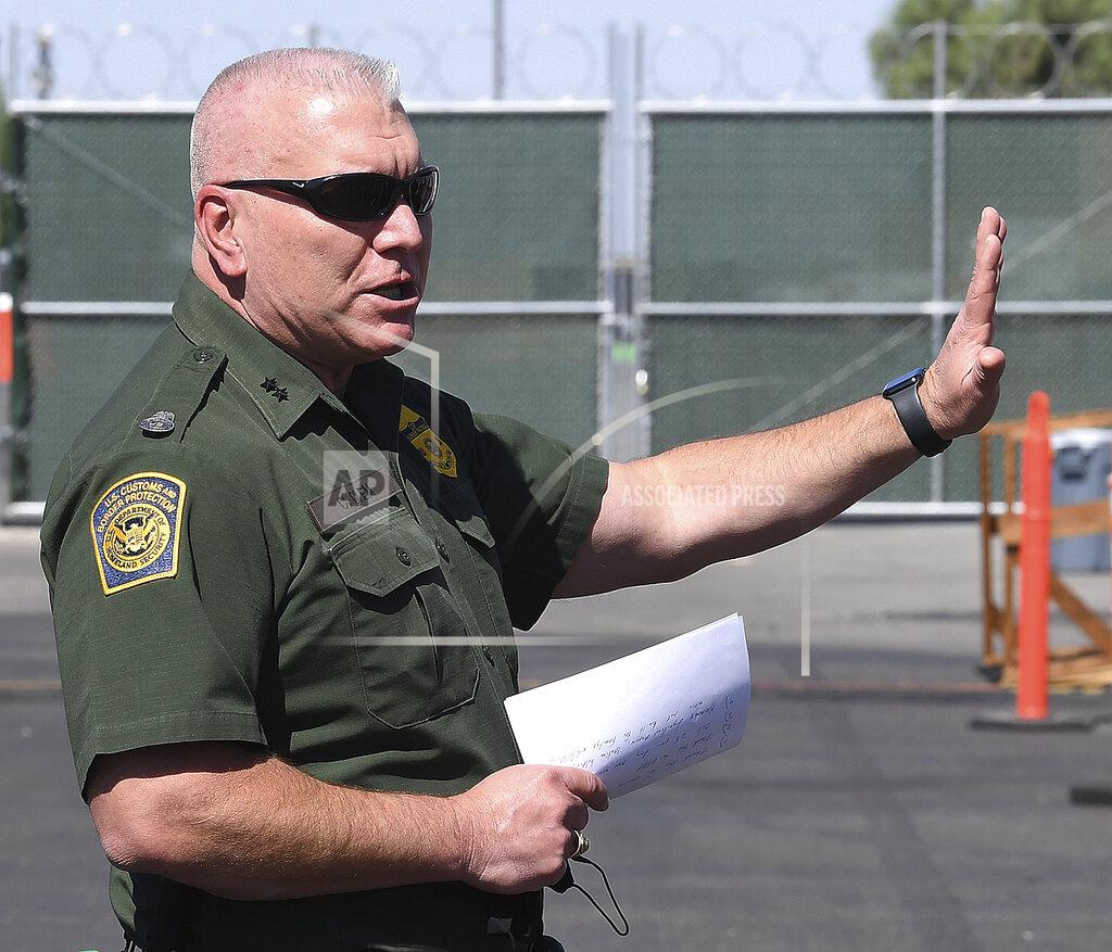 Randy Hoeft U.S. Border Patrol Yuma Sector, Chief Patrol Agent Chris Clem speaks to those on hand for an open house, Tuesday, April 20, 2021, in Yuma, Ariz., during which the public could tour the soft-sided processing facility which will handle detained illegal immigrants who are apprehended while crossing the border into the United States from Mexico. (Randy Hoeft/The Yuma Sun via AP)